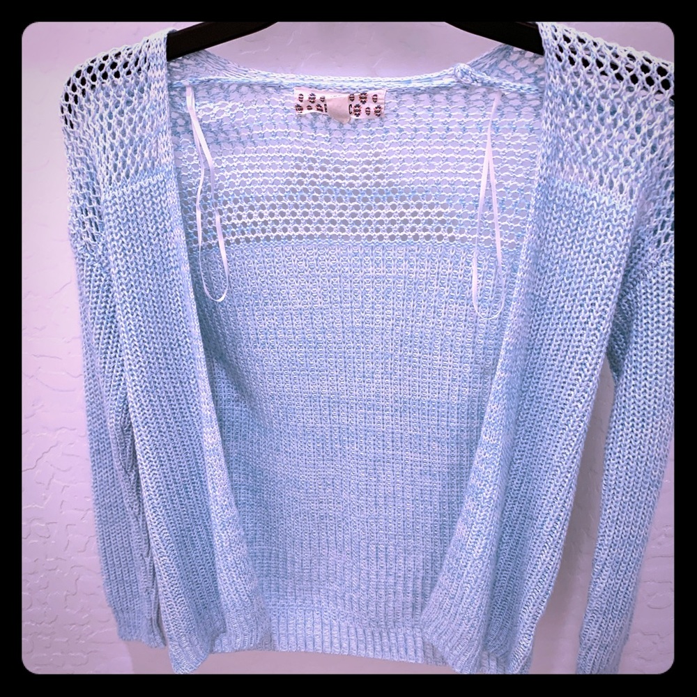 Light greenish blue sweater
